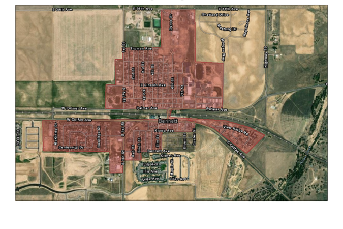 A satellite map of the Town of Bennett highlighting the "PRV Eligible Neighborhoods" shaded in red. The highlighted areas include several regions north and south of Palmer Avenue, stretching from near E 38th Avenue in the north to Lilac Avenue in the south, and from McKinney Drive in the west to View Ridge Road and E Colfax Avenue in the east. Key labeled streets within the eligible zones include 1st–8th Streets, Lincoln Avenue, Kiowa Avenue, Birch Street, Lilac Avenue, and more. Landmarks such as Ace Hardw